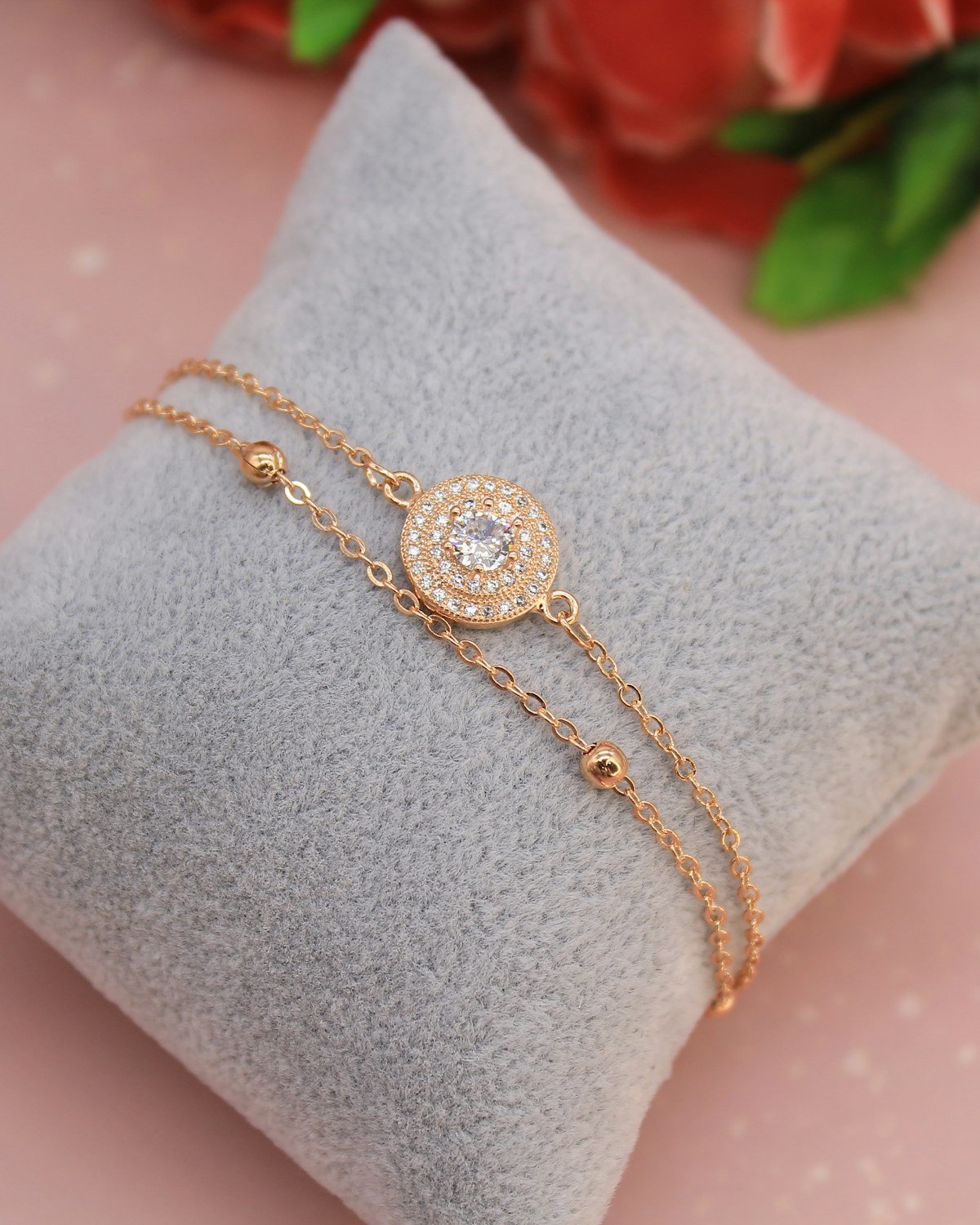 Fine gold bracelet on a cushion