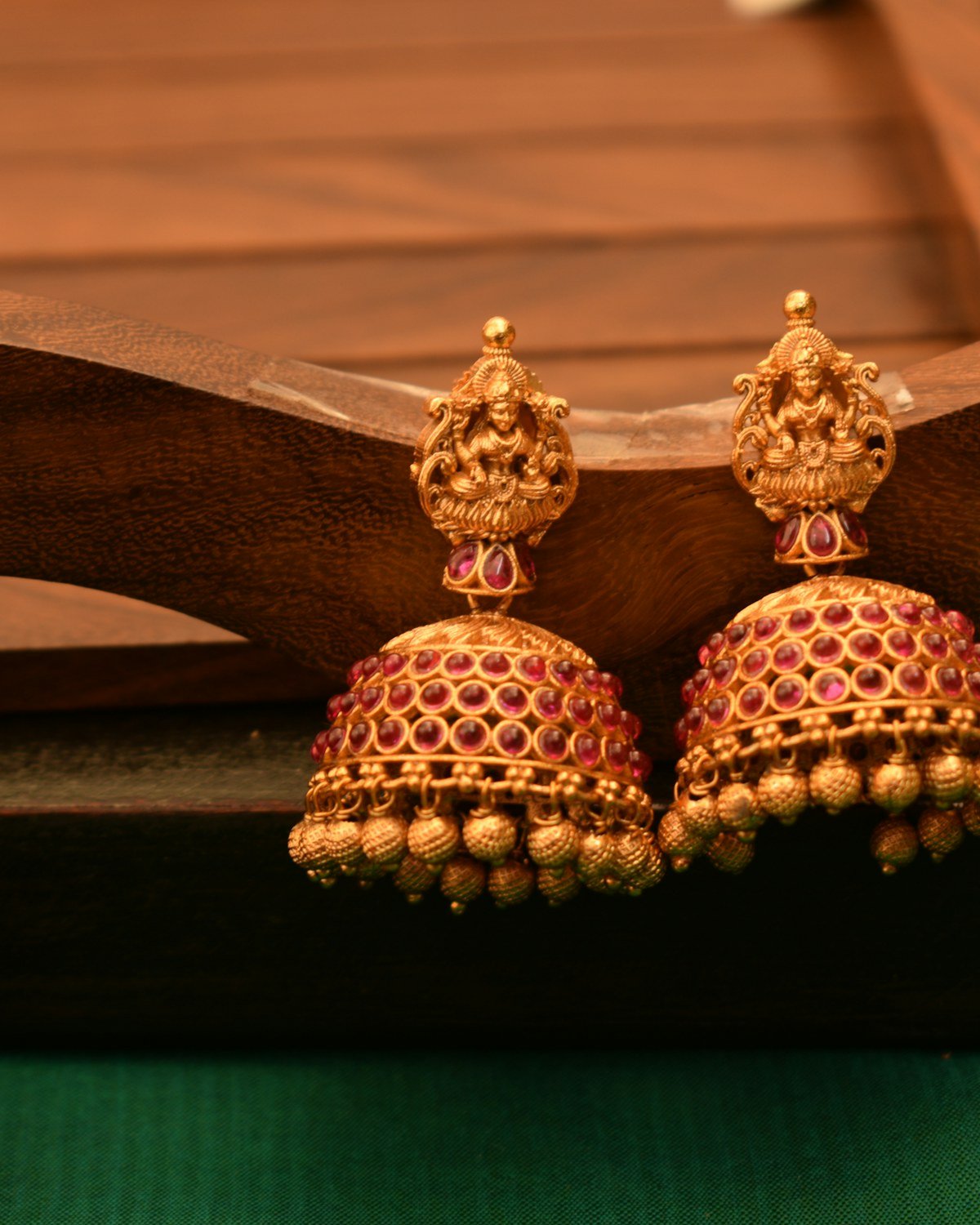Pair of gold jhumka earrings