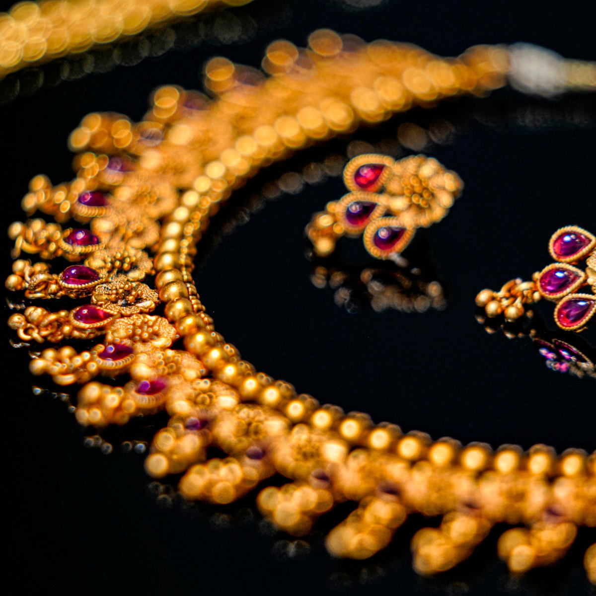 Temple-style gold necklace with ruby drops